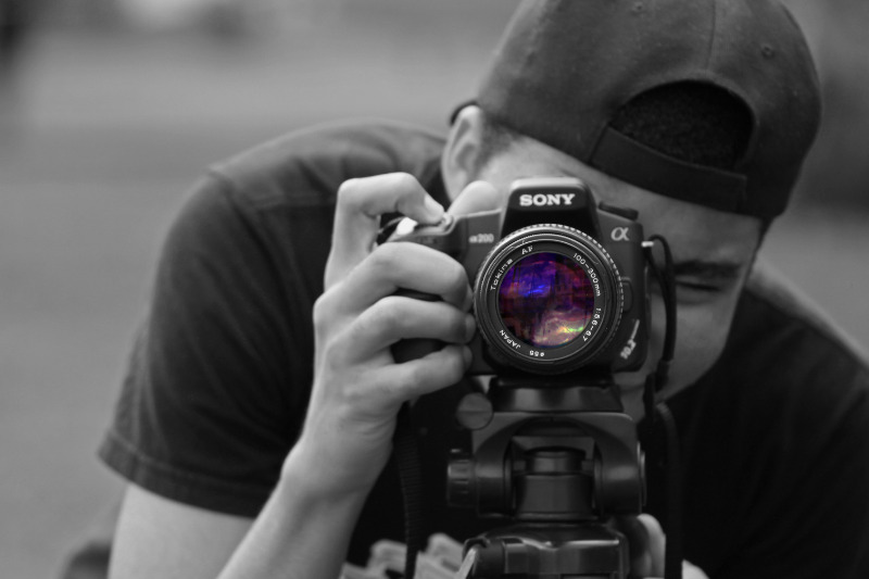How to Get Free Stock Photos for Your Blog Man taking a photograph with a camera