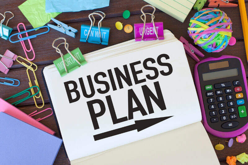 Why You Need a Business Plan for Your Blogging Venture Paper with words 'Business Plan' printed on it