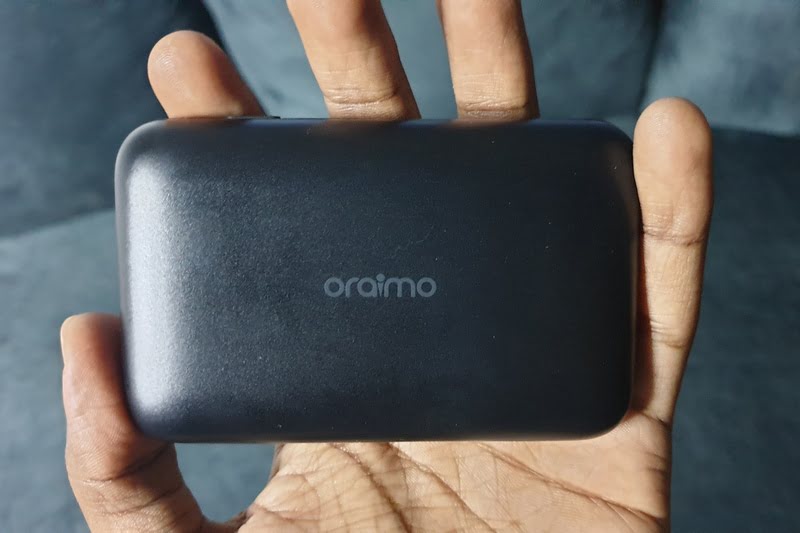 Man holding oraimo mifi router