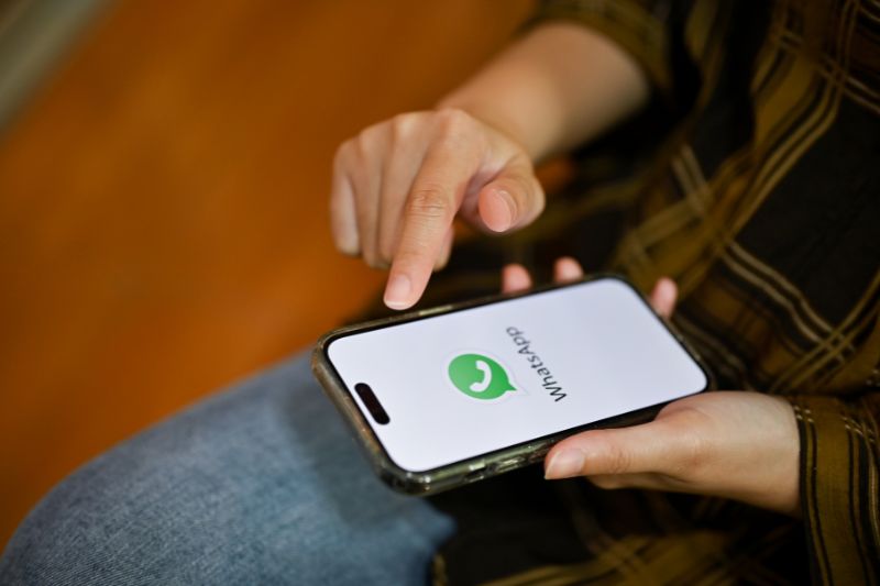 How to Check Muted Status Updates on WhatsApp Man using WhatsApp on phone